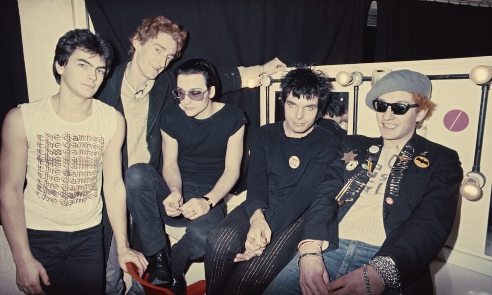 Group portrait of an early line up of punk band The Damned backstage, London, 1977. L-R Jon Moss (later of Culture Club), Lu Edmonds, Dave Vanian, Brian James and Captain Sensible. (Photo by Erica Echenberg/Redferns)